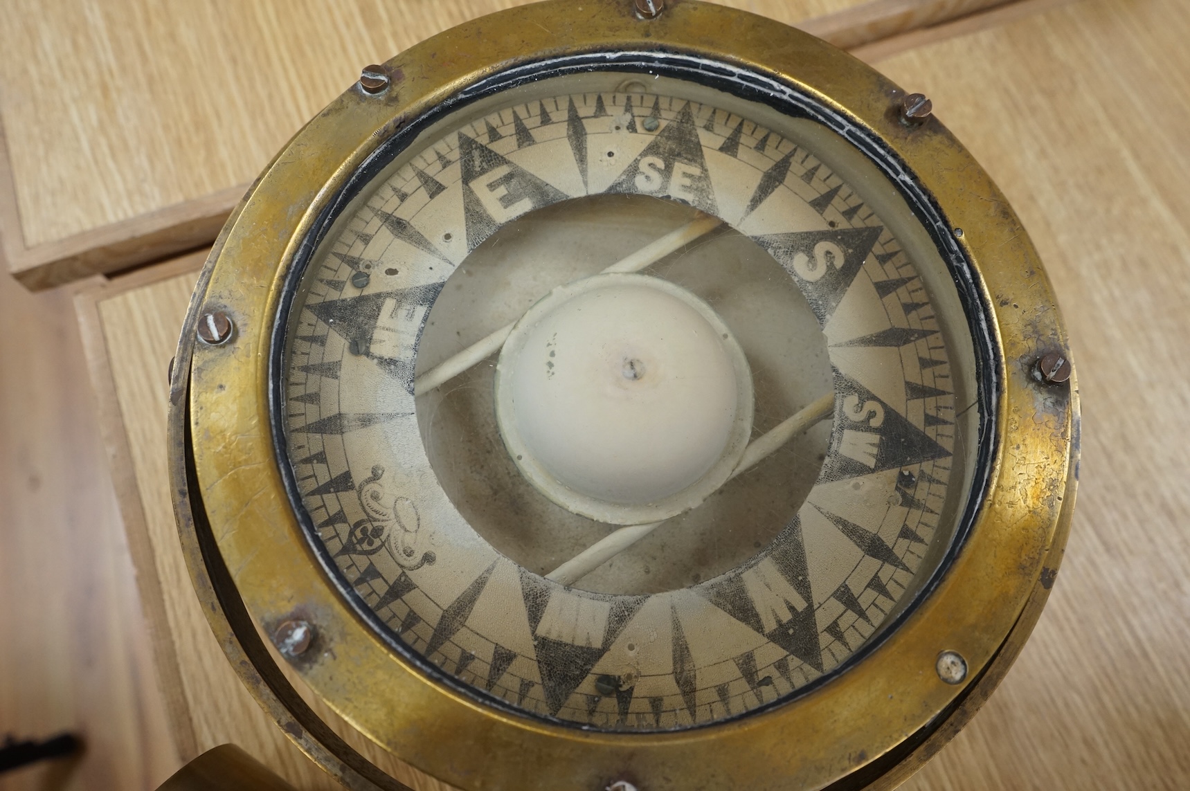 A brass ship's compass in gimbal and a copper water hydrant, 95.5cm
